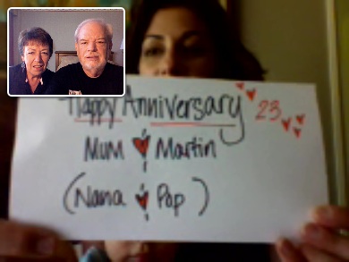 Sharon, Anthony & Julius with Happy anniversary sign